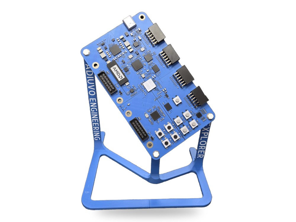 Finished large-scale Explorer Board display on its blue ADIUVO ENGINEERING and EXPLORER stand